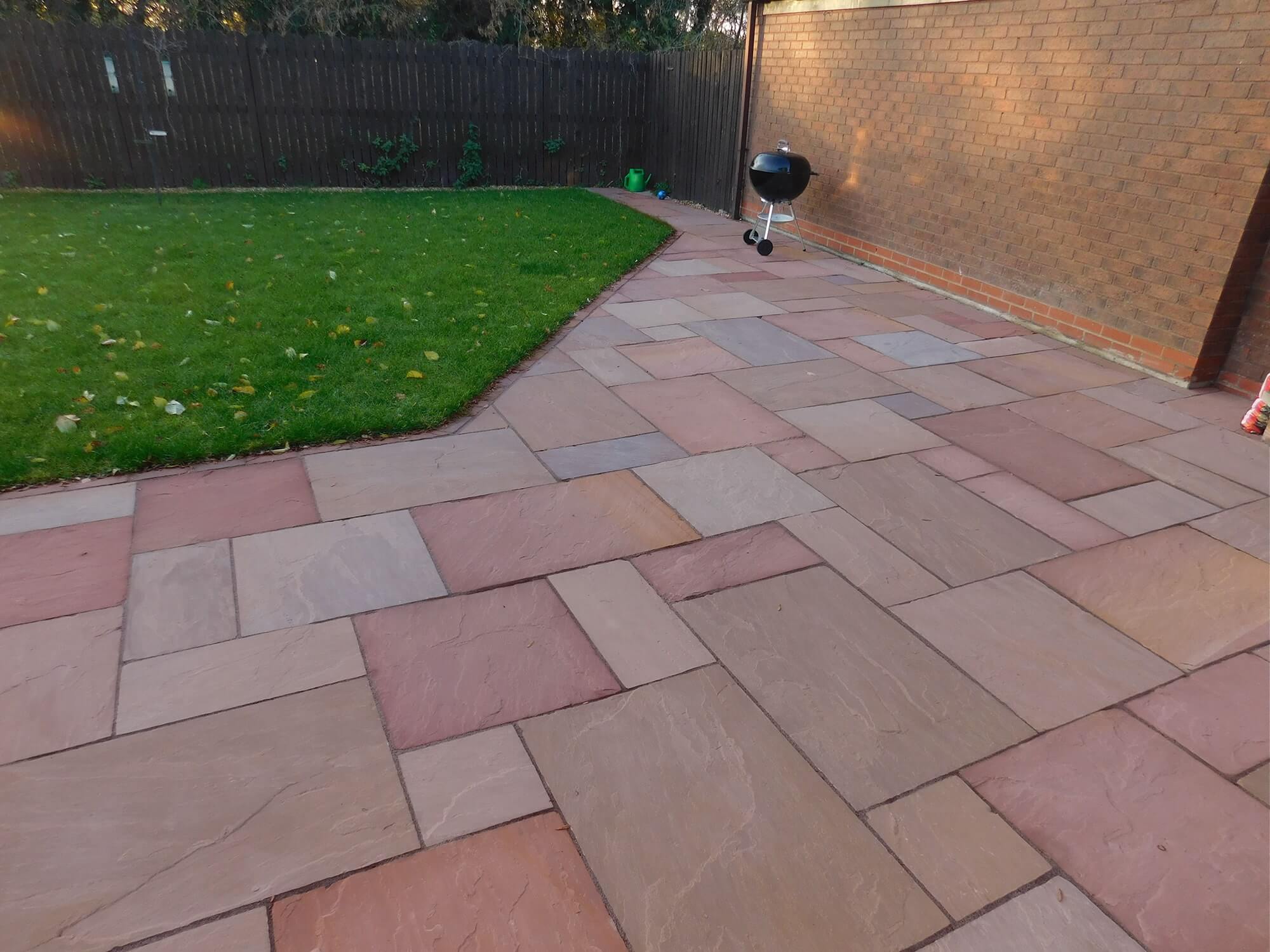 Flagstone driveway front garden
